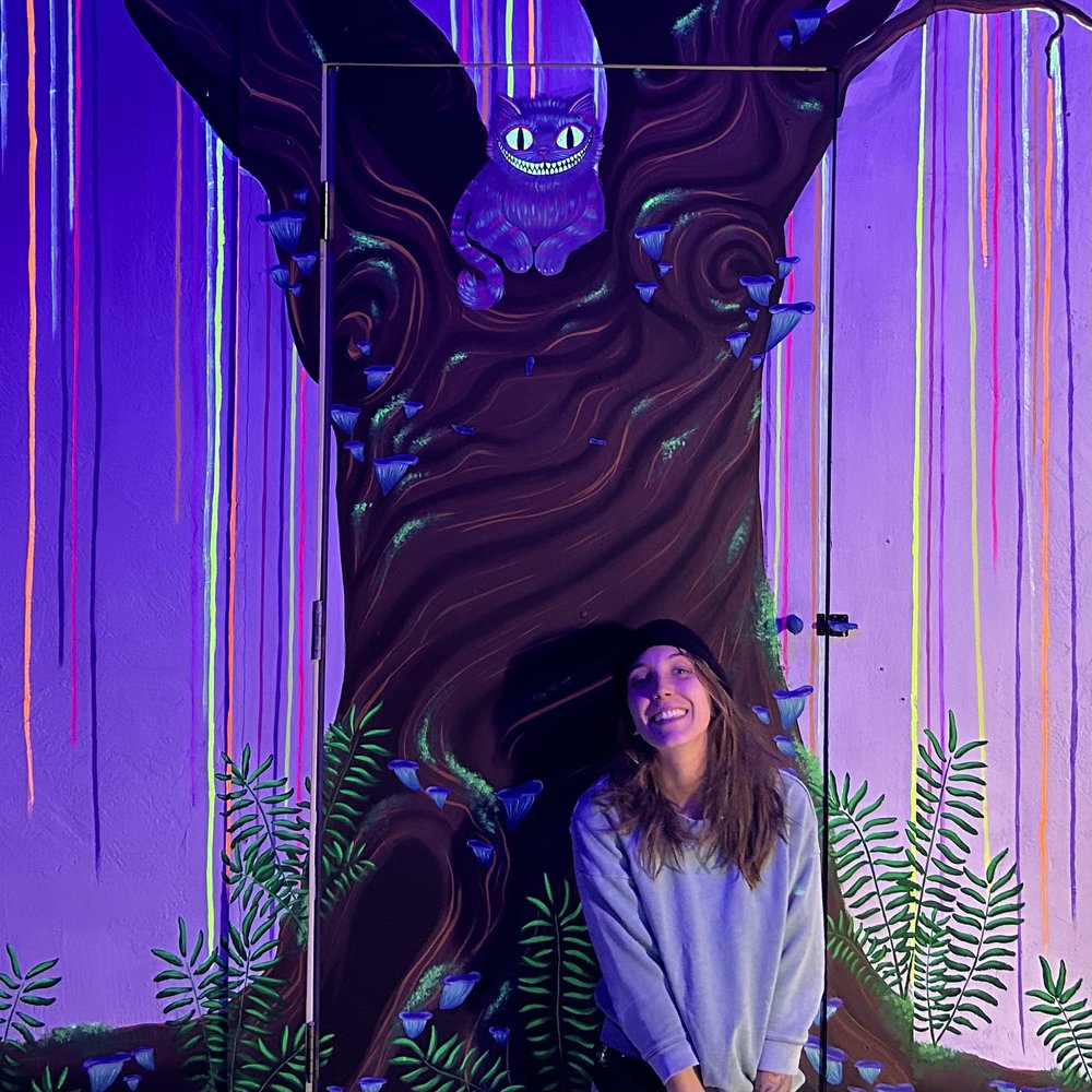 painting of tree with Kat smiling